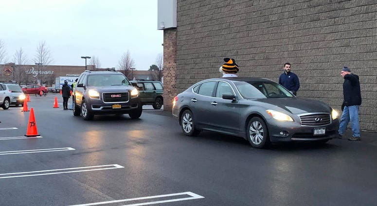 Derek Smith from the Buffalo Sabres volunteers at Turkeys for Tickets. November 20, 2019 (WBEN Photo/Mike Baggerman)