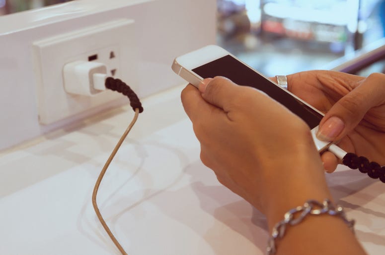 Phone Charging in Wall Outlet Phone Charging in Wall Outlet