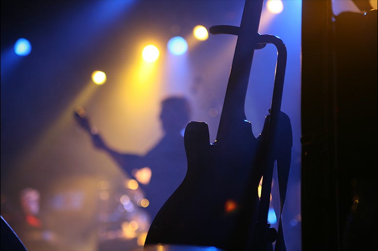 Guitar at a concert Dreamstime image