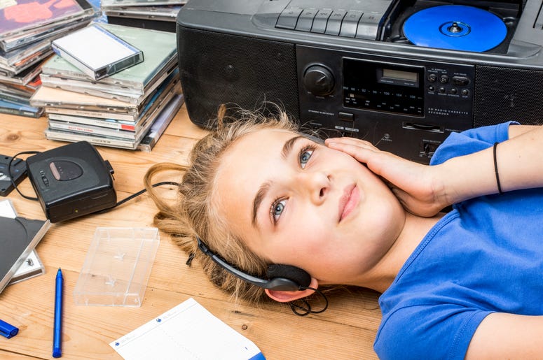 Girl Listening to CDs Girl Listening to CDs