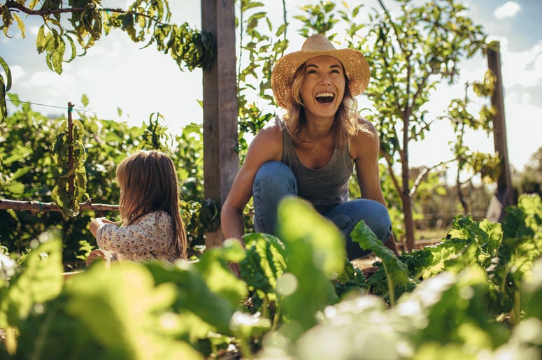 Woman and girl gardening