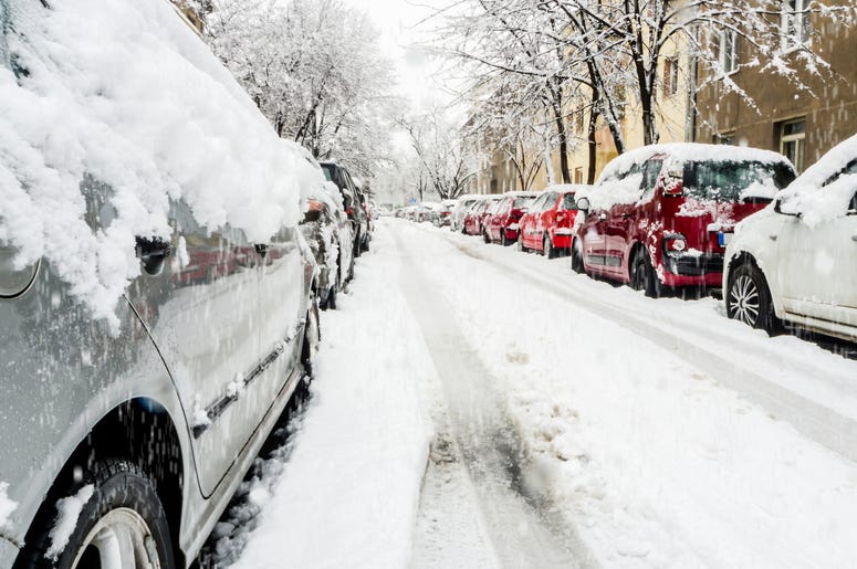 Cars on a snowy city street