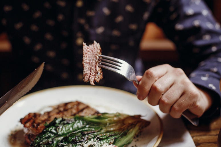 Person eating meat Person eating meat