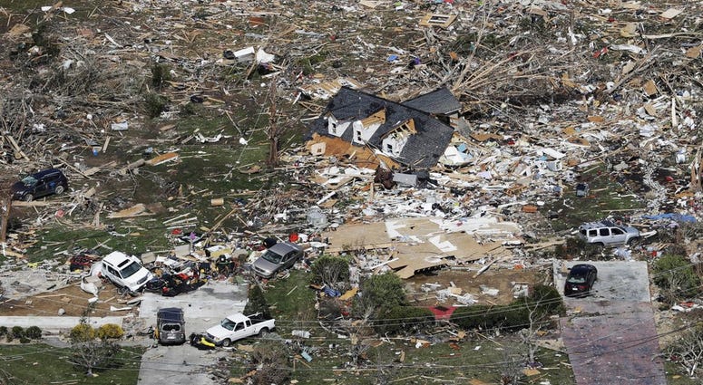 The remains of homes shattered by storms are scattered near Cookeville, Tenn., Tuesday, March 3, 2020.