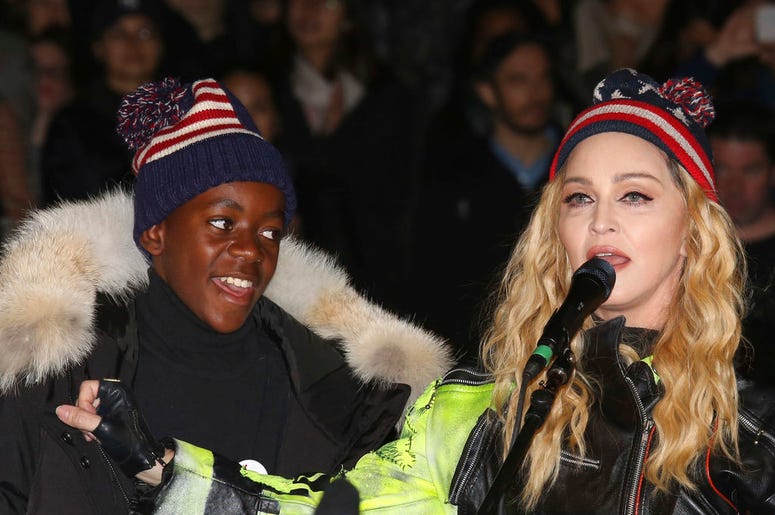 2016 file photo, U.S. Singer Madonna, right, and her son David Banda perform in support of Democratic presidential candidate Hillary Clinton at Washington Square Park.
