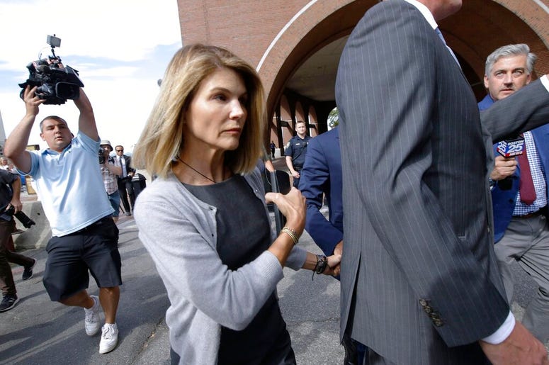 n this Aug. 27, 2019 file photo, actress Lori Loughlin departs federal court in Boston after a hearing in a nationwide college admissions bribery scandal.