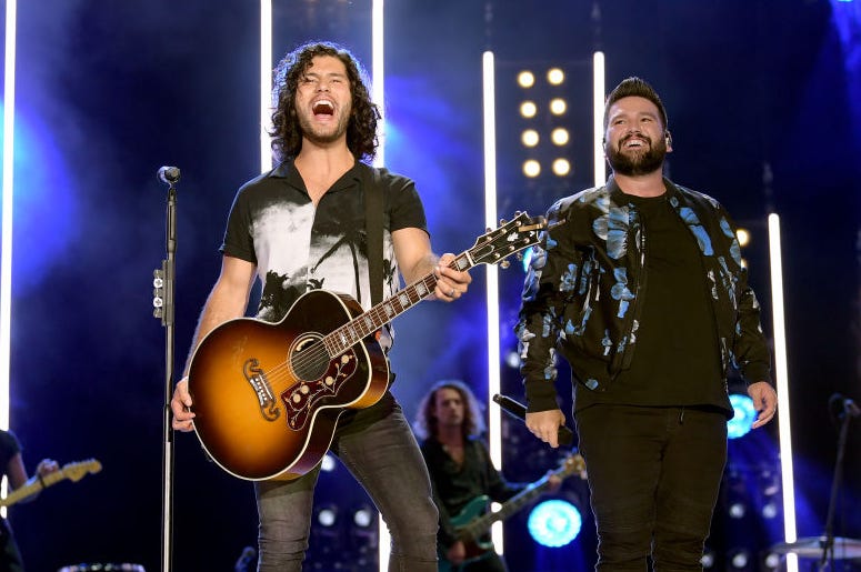 Dan Smyers and Shay Mooney of Dan + Shay perform on stage Dan Smyers and Shay Mooney of Dan + Shay perform on stage