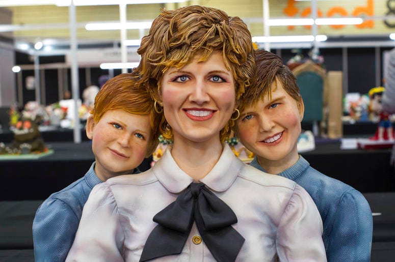 A cake in the likeness of Princess Diana, with sons Prince Harry, left, and Prince William on display during Cake International, The Sugarcraft, Cake Decorating and Baking Show, at the NEC in Birmingham, England DO NOT USE