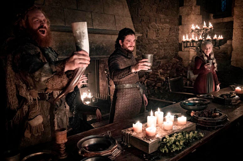 This image released by HBO shows Kristofer Hivju, from left, Kit Harington and Emilia Clarke in a scene from "Game of Thrones." "Game of Thrones," "Veep" and "The Big Bang Theory," three major series that wrapped last season, will find out with Tuesday's