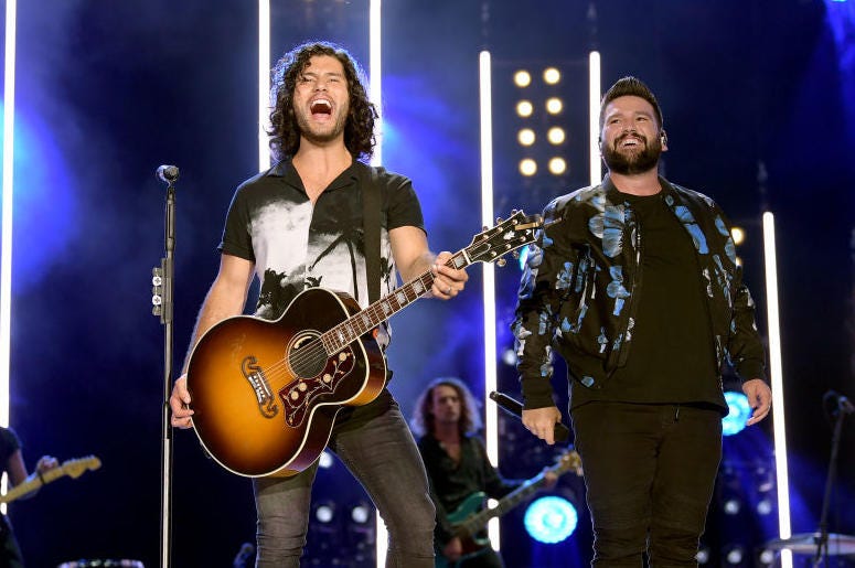 Dan Smyers and Shay Mooney of Dan + Shay perform on stage Dan Smyers and Shay Mooney of Dan + Shay perform on stage