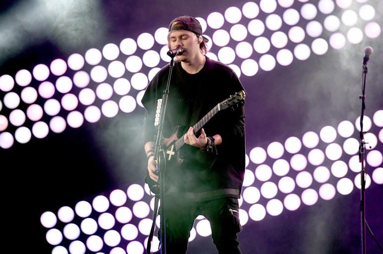 Michael Clifford of music group 5 Seconds of Summer performs onstage Michael Clifford of music group 5 Seconds of Summer performs onstage