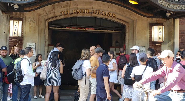 Commuters wait for updates on PATH service at Christopher Street on June 27, 2019. PATH Crowd