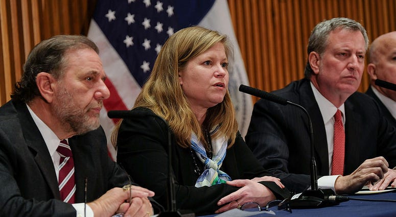 Department of Sanitation Commissioner Kathryn Garcia with Mayor Bill de Blasio and Joe Esposito Kathryn Garcia