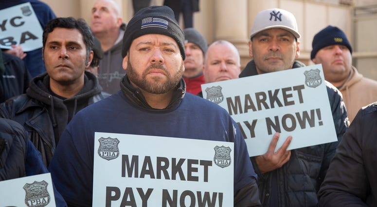 NYPD officers rally in front of City Hall to demand fair pay NYPD Fair Pay rally