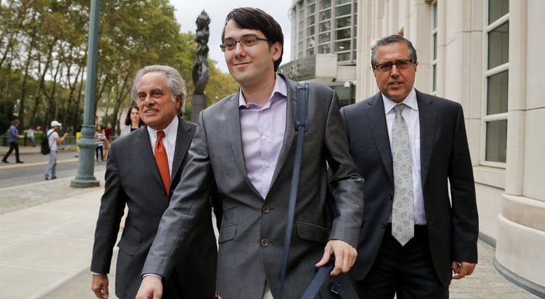 In this Thursday, July 27, 2017, file photo, Martin Shkreli, center, leaves federal court with his attorney Benjamin Brafman, left, in New York. Martin Shkreli