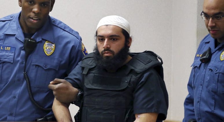 In this Dec. 20, 2016, file photo, Ahmad Khan Rahimi, center, is led into court in Elizabeth, N.J. Ahmad Khan Rahimi
