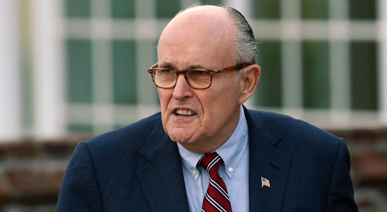 In this Nov. 20, 2016 file photo, former New York Mayor Rudy Giuliani arrives at the Trump National Golf Club Bedminster clubhouse in Bedminster, N.J. Rudy Giuliani