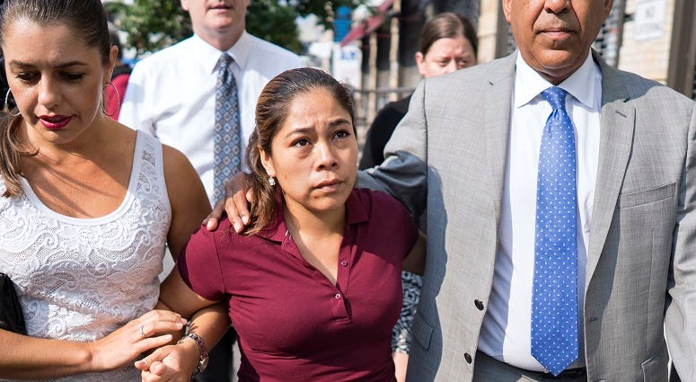 Yeni Gonzalez, center, a Guatemalan mother who was separated from her three children at the U.S.-Mexico border arrives Tuesday, July 3, 2108 to reunite with them in New York. Yeni Gonzalez