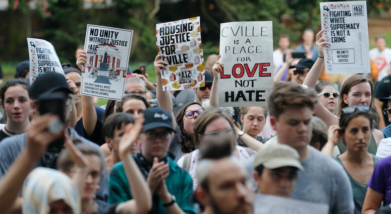 Demonstrators march on the campus of the University of Virginia Charlottesville protests