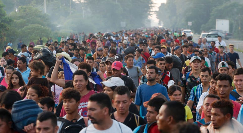 Central American migrants walking to the U.S. start their day departing Ciudad Hidalgo, Mexico, Sunday, Oct. 21, 2018. Immigrant Caravan