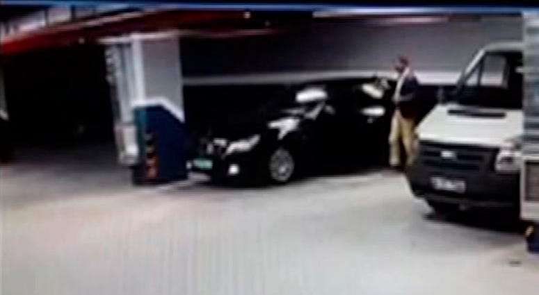 In this CCTV video made available from Turkish TRT TV, Monday Oct. 22, 2018, showing a man getting out of a vehicle seemingly with Saudi consulate plates, at an underground car park in Istanbul. Khashoggi body double