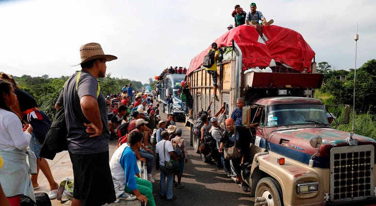 entral American migrants, part of the caravan hoping to reach the U.S. border, get a ride on trucks, in Donaji, Oaxaca state, Mexico, Friday, Nov. 2, 2018. migrant caravan
