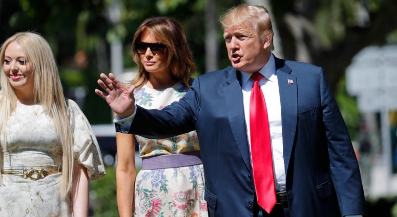 President Donald Trump, right, with first lady Melania Trump, center, and daughter Tiffany Trump, left, arrive for Easter services at Episcopal Church of Bethesda-by-the-Sea, Sunday, April 21, 2019, in Palm Beach, Fla. President Donald Trump Easter