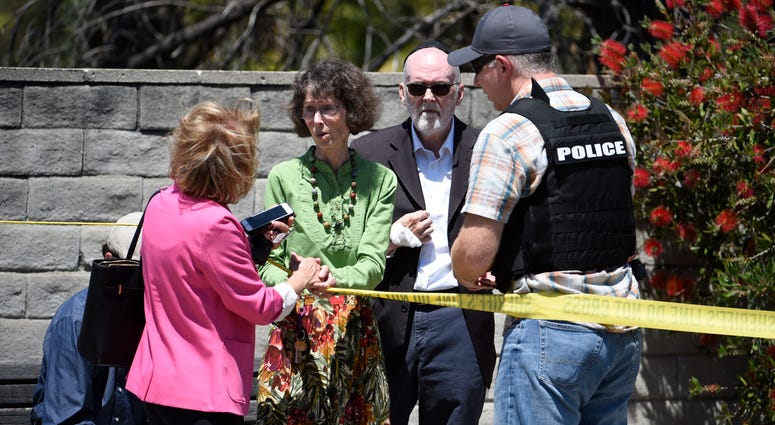 Synagogue members console one another outside of the Chabad of Poway Synagogue Saturday, April 27, 2019, in Poway, Calif. Synagogue shooting San Diego