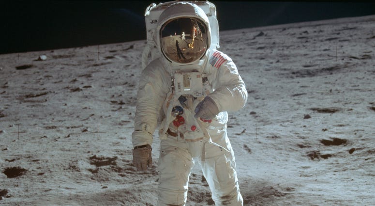 In this July 20, 1969 photo made available by NASA, astronaut Buzz Aldrin, lunar module pilot, walks on the surface of the moon during the Apollo 11 extravehicular activity. Moon landing