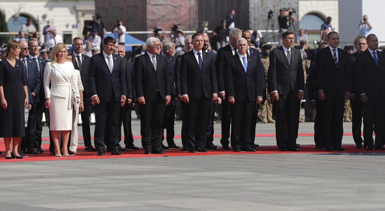 Officials and leaders, among them U.S. Vice President Mike Pence, Polish President Andrzej Duda, and German President Frank-Walter Steinmeier stand during a memorial ceremony marking the 80th anniversary of the start of World War II in Warsaw, Poland, Sun World War II anniversary