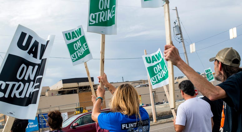 Flint resident Jashanti Walker, who has been a first shift team leader in the body shop for two years, demonstrates with more than a dozen other General Motors employees outside of the Flint Assembly Plant on Sunday, Sept. 15, 2019, in Flint, Mich. GM strike