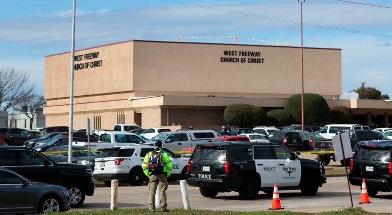 A person stands near the scene of a church shooting at West Freeway Church of Christ on Sunday, Dec. 29, 2019 in White Settlement, Texas. Texas church shooting