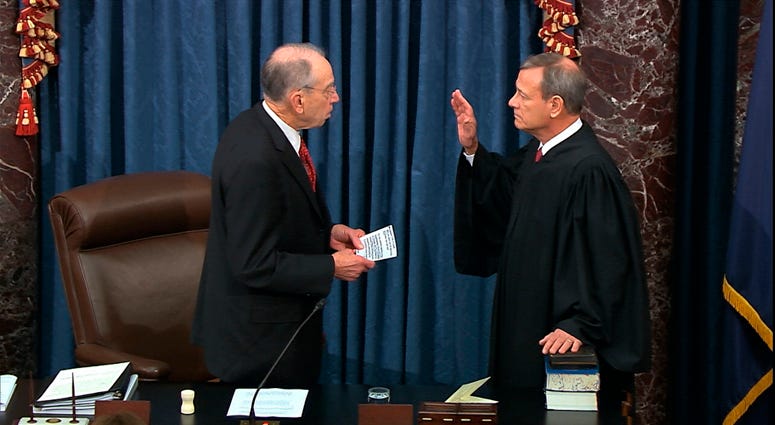 In this image from video, President Pro Tempore of the Senate Sen. Chuck Grassley, R-Iowa., swears in Supreme Court Chief Justice John Roberts as the presiding officer for the impeachment trial of President Donald Trump in the Senate at the U.S. Capitol i Chief Justice John Roberts sworn in
