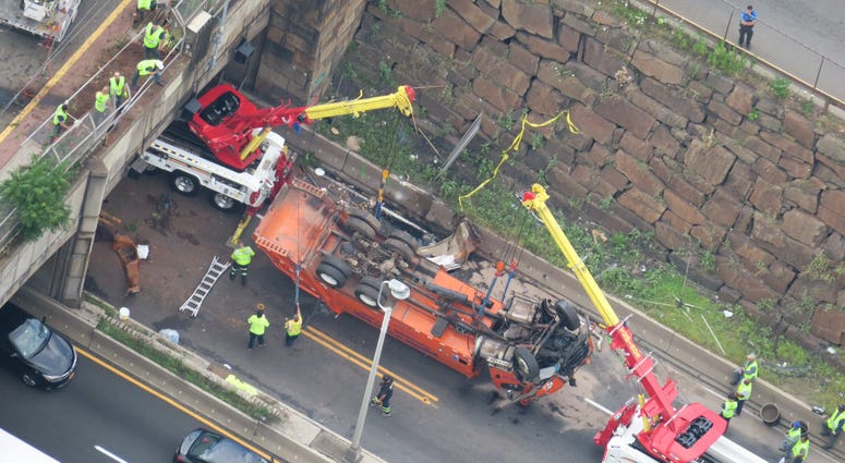 A dump truck overturned on the westbound I-495 in Union City Overturned Dump Truck