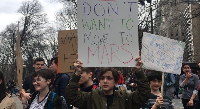 Students march through Manhattan to demand action on climate change on March 15, 2019. Students Climate Change protest