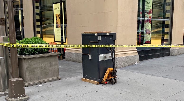 An abandoned safe left on a corner in Midtown Abandoned Safe