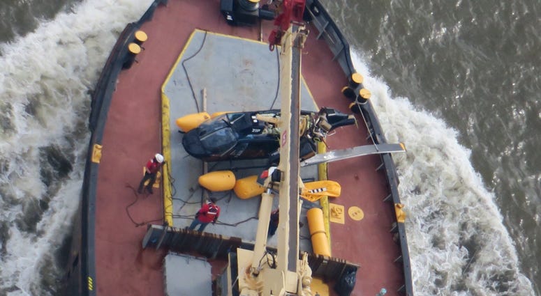 A helicopter overturned in the Hudson River. Helicopter in Hudson