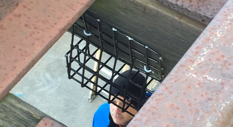A basket that catches bolts from elevated subway tracks Subway debris basket