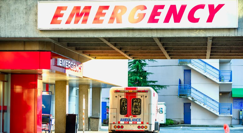 Ambulance car in front of emergency entrance. Hospital