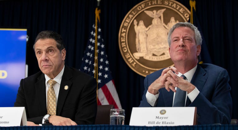 New York Governor Andrew Cuomo and New York City Mayor Bill de Blasio listens to questions from reporters during a press conference to discuss Amazon's decision to bring a new corporate location to New York City, November 13, 2018. Mayor De Blasio And Governor Cuomo