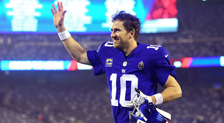 Eli Manning #10 of the New York Giants runs off the field after his teams 30-27 win over the Chicago Bears at MetLife Stadium on December 02, 2018 in East Rutherford, New Jersey. Eli Manning