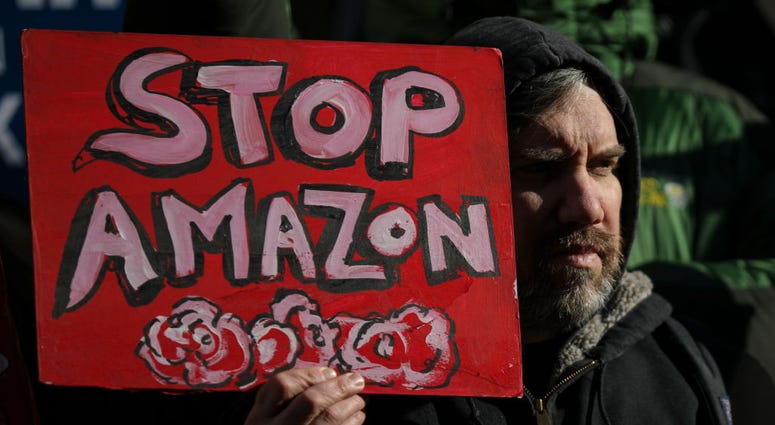 Protestors rally against Amazon and the company's plans to move their second headquarters to the Long Island City neighborhood of Queens, at New York City Hall, January 30, 2019 in New York City. Amazon Protest