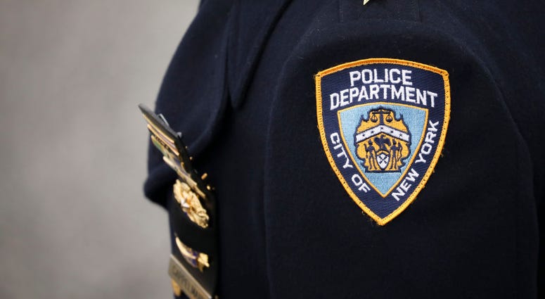 An NYPD officer arrives for the funeral service of fallen NYPD Detective Brian Simonsen at the Church of St. Rosalie, February 20, 2019 in Hampton Bays, New York. NYPD officer