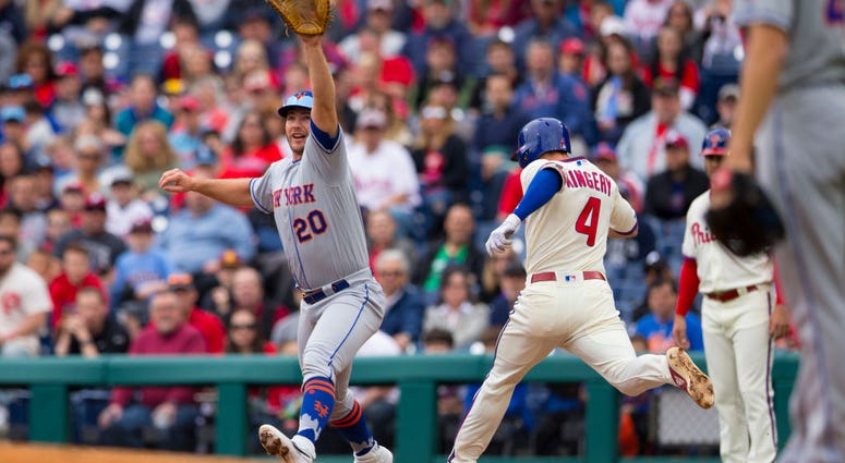 Pete Alonso #20 of the New York Mets forces out Scott Kingery #4 of the Philadelphia Phillies in the bottom of the first inning at Citizens Bank Park on April 17, 2019 in Philadelphia, Pennsylvania. Pete Alonso - Mets v Phillies