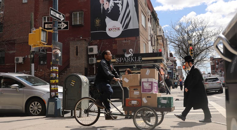 People walk through an ultra-Orthodox Jewish community in Williamsburg on April 10, 2019 in New York City. Williamsburg