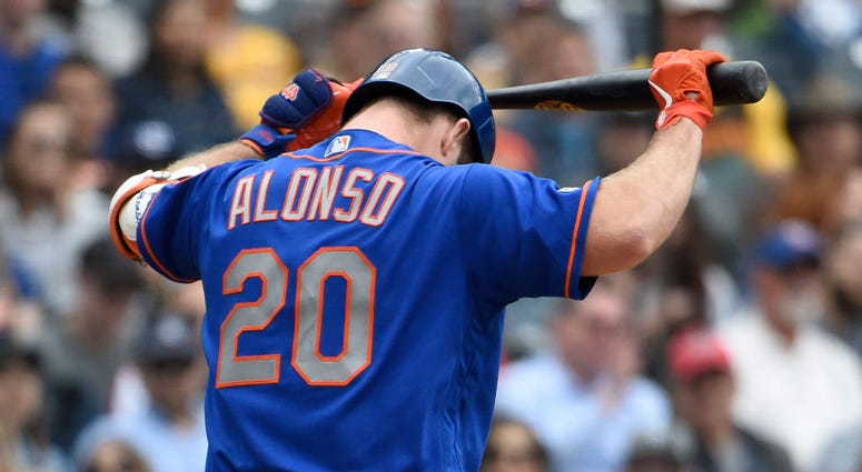 Pete Alonso #20 of the New York Mets walks back to the dugout after striking out during the ninth inning of a baseball game against the San Diego Padres at Petco Park May 8, 2019 in San Diego, California. Pete Alonso - Mets v Padres