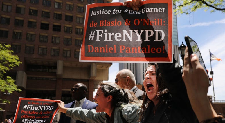 Protesters gather outside of Police Headquarters to protest during the police disciplinary hearing for Officer Daniel Pantaleo, who was accused of recklessly using a chokehold that led to Garner’s death during an arrest in July 2014 on May 21, 2019. Fire Daniel Pantaleo Trial