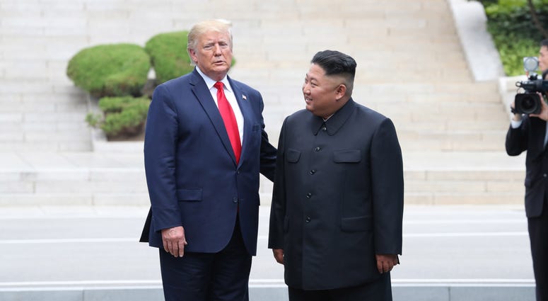 A handout photo provided by Dong-A Ilbo of North Korean leader Kim Jong Un and U.S. President Donald Trump inside the demilitarized zone (DMZ) separating the South and North Korea on June 30, 2019 in Panmunjom, South Korea Trump Kim