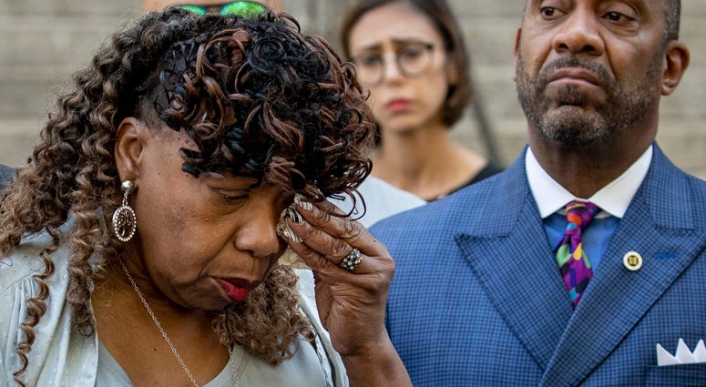 Gwen Carr, mother of the late Eric Garner, wipes away tears after speaking to the press outside the U.S. Attorney's office following a meeting with federal prosecutors, July 16, 2019 in Brooklyn. Gwen Carr, Eric Garner's mother