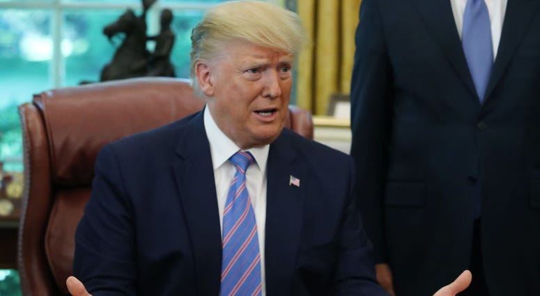 President Donald Trump speaks to the media after signing a bill for border funding in the Oval Office at the White House on July 1, 2019 in Washington, DC. President Donald Trump